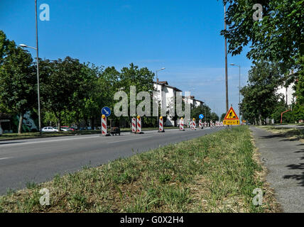 Traffic signs on the roadway in a city street. Stock Photo