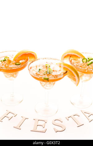 Spicy grapefruit margarita on ice in margarita glasses. Stock Photo