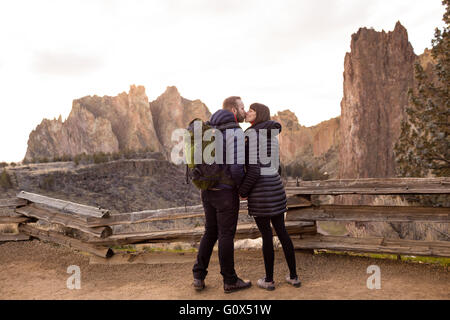 Lifestyle portrait of an engaged couple that loves the outdoors at Smith Rock State Park in Central Oregon. Stock Photo