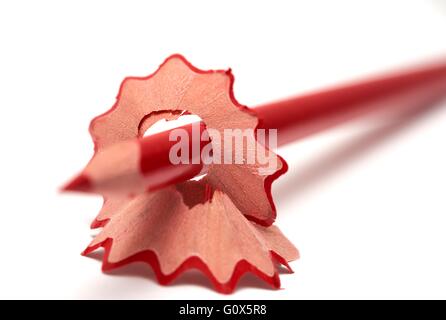 Pencil shavings and a red pencil close up macro. Stock Photo