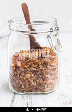 Brown candied sugar in a glass jar Stock Photo