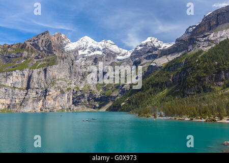 Stunning view of Oeschinensee (Oeschinen lake) with Bluemlisalp and Frundenhorn of swiss alps on Bernese Oberland. Photo taken i Stock Photo
