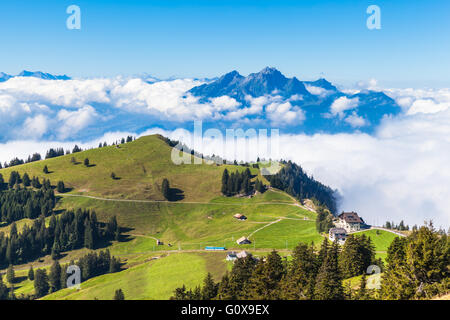 Stunning view of the Pilatus above the clouds from top of Rigi mountain, Lucerne, Switzerland Stock Photo