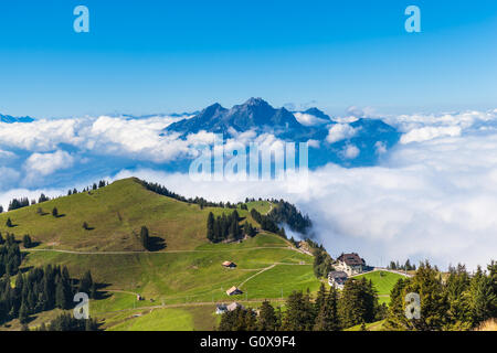 Stunning view of the Pilatus above the clouds from top of Rigi mountain, Lucerne, Switzerland Stock Photo