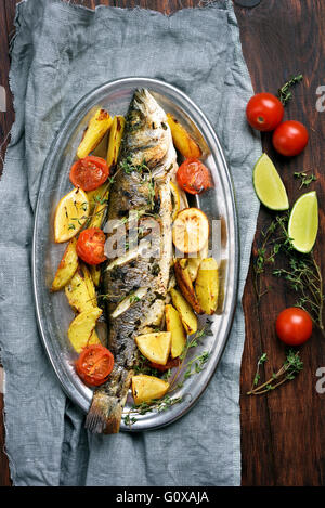 Grilled fish with baked vegetables, top view Stock Photo