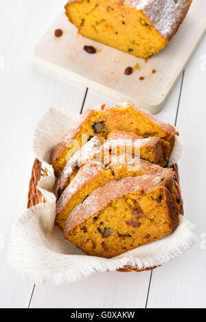 Sliced pumpkin bread loaf with nuts and raisin Stock Photo