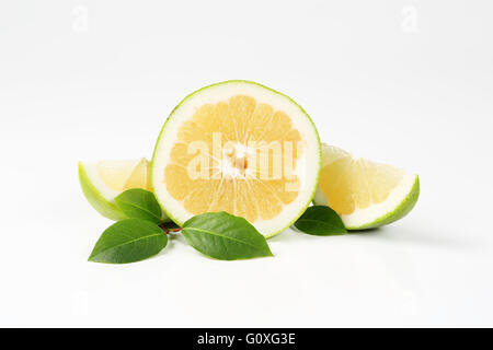 sliced green grapefruit on white background Stock Photo