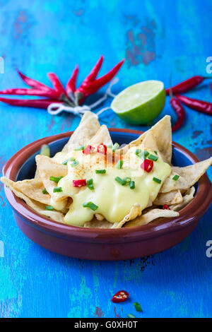 Nachos with homemade cheese sauce, tex-mex dish perfect for football snacking Stock Photo