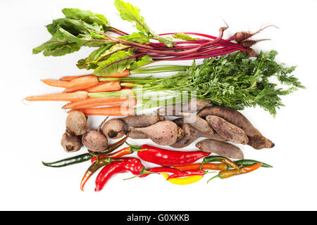 Bunch of  beet leaves, carrots, beetroot and chili pepper on white background Stock Photo