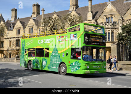 An Oxford City tour bus in front of Magdalen College, Oxford, England Stock Photo