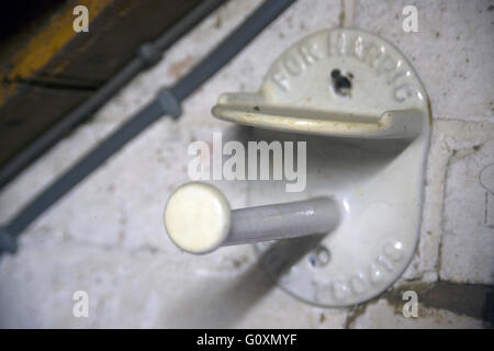 Old toilet roll holders, with holders for Harpic cleanser blocks, from the Thomas Crapper Collection, Stratford upon Avon, Warwickshire, England Stock Photo