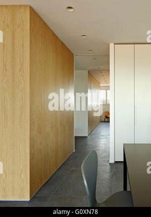 Escorial Apartment, Barcelona, Spain. Partial view of a modern chair and table. Stock Photo