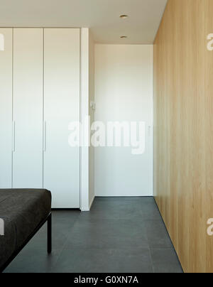 Escorial Apartment, Barcelona, Spain. Partial view of a grey bed. Stock Photo