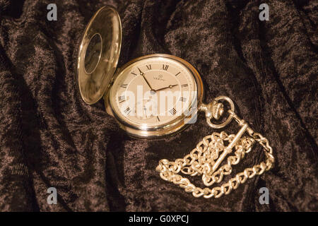 A open pocket watch and chain Stock Photo