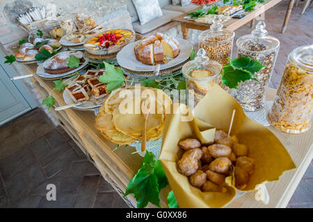 Homemade sweet pastries with fruit, jam and croissants for breakfast Stock Photo