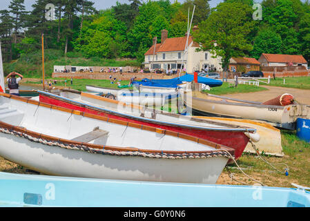 Ramsholt Suffolk pub, view of boats drawn up along the River Deben with the Ramsholt Arms public house in the distance, Suffolk, England. Stock Photo