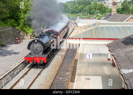 Steam train arriving at Matlock Railway Station. Peak Rail, Derbyshire, England, UK Stock Photo