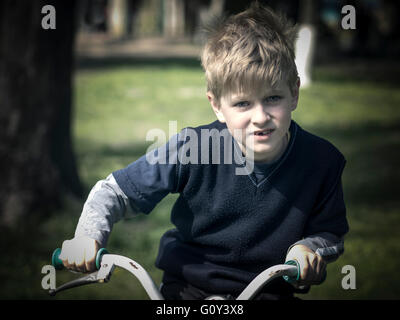 Portrait of a boy on a bicycle Stock Photo