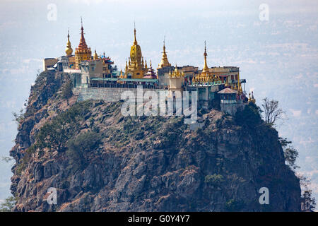 A view from above on the whole of monasteries, stupas and sanctuaries of Taung Kalat Mount Popa (2,427 ft or so). Stock Photo