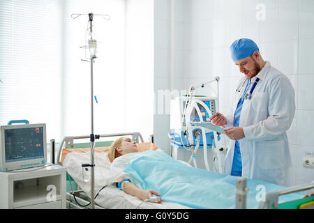 Woman in intensive care unit Stock Photo