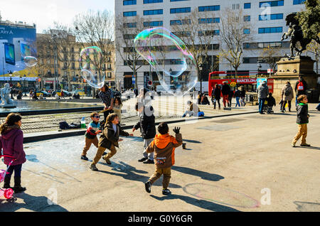 Street performers blow soap bubbles in Plaça de Catalunya Barcelona Catalonia Spain Stock Photo