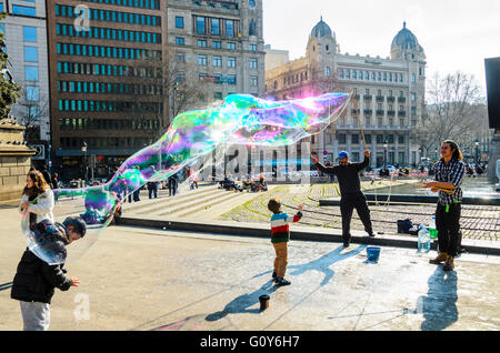 Street performers blow soap bubbles in Plaça de Catalunya Barcelona Catalonia Spain Stock Photo