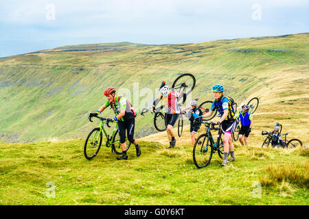 Riders ascending Ingleborough in the 2015 Three Peaks cyclocross race, an annual event over three Yorkshire mountains Stock Photo