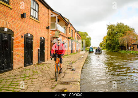 Cyclist on canal towpath at Burscough Lancashire Stock Photo