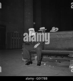 Sailor Asleep in Waiting Room, Union Station, Chicago, Illinois, USA, by Jack Delano for Office of War Information, January 1943 Stock Photo