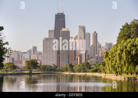 Skyline of Chicago reflected in the South Lagoon at Lincoln Park in Chicago, Illinois, USA