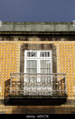 Detail of window, balcony and ceramic tiles on wall of typical building, Praça Conselheiro Silva Torres main square, Caminha, Minho Province, Portugal Stock Photo