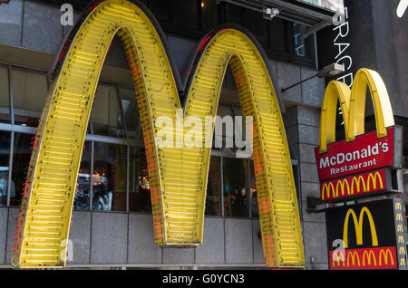 Large neon McDonald's Restaurant sign in Times Square, New York City Stock Photo
