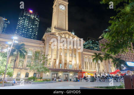 Brisbane City Hall facade and clock tower Italian Renaissance architectural style lit up at night from King George Square Stock Photo