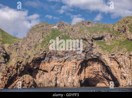 August 3, 2015 - The much visited Klettshellir Cave below rugged ...