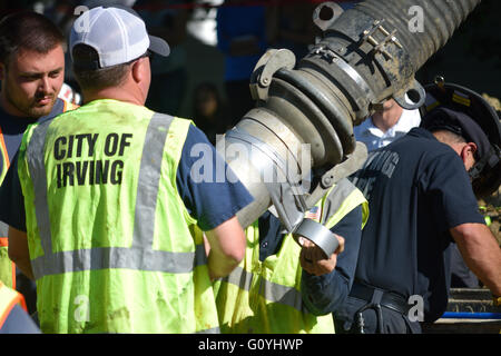 Irving, TX, USA. 5th May, 2016. Rescue workers help dig out a construction worker who was trapped in a twelve foot deep ditch. Credit:  Brian Humek/Alamy Live News. Stock Photo