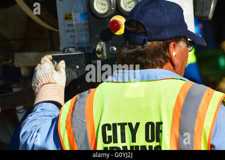 Irving, TX, USA. 5th May, 2016. Rescue workers help dig out a construction worker who was trapped in a twelve foot deep ditch. Credit:  Brian Humek/Alamy Live News. Stock Photo