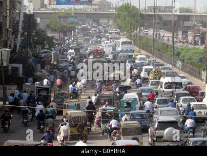 Huge numbers of motors are stuck in traffic jam due to miss handling in by traffic police staffs, at Teen Hatti area, in Karachi on Friday, May 06, 2016. Stock Photo