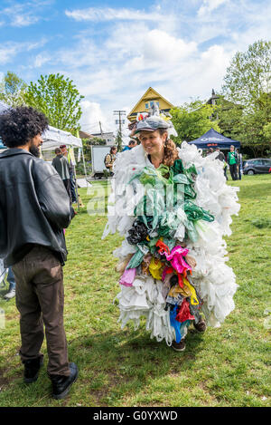 Earth Day Vancouver, woman wearing dress made from plastic bags. Stock Photo