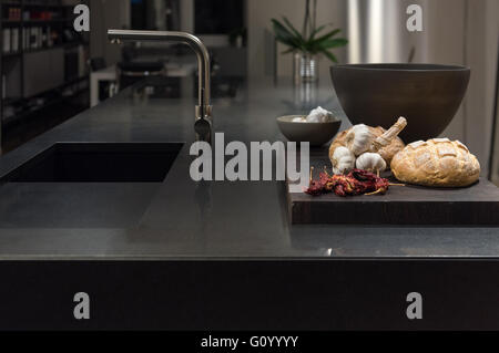 Cool and Classy, Modern and Stylish Kitchen with Black Granite Stone Worktop Stock Photo