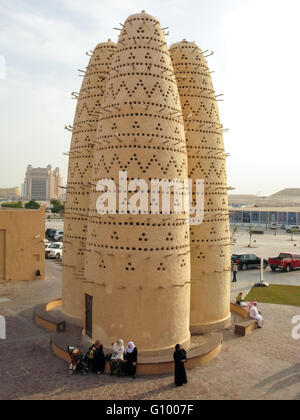 People relaxing near Pigeon Towers in Katara Cultural Village, Doha, Qatar Stock Photo