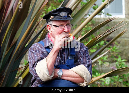 A steam engine enthusiast taking a break Stock Photo
