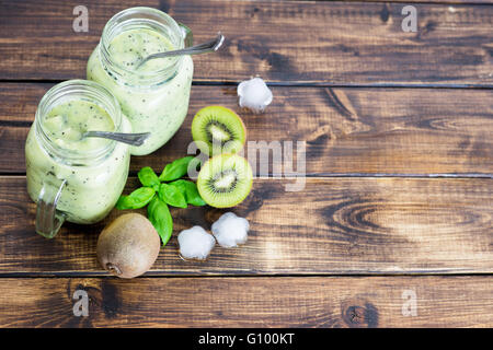Kiwi green detox smoothie in two cups Stock Photo