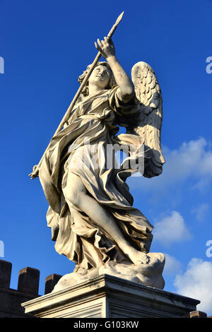 Marble statue of angel holding the Holy Lance of Longinus from Sant'Angelo bridge monumental balustrade in the center of Rome Stock Photo