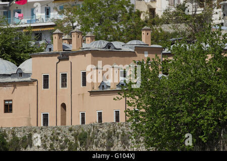 Chimneys and lead domes part of the building facade. IMARET or Kulliye monument & restored hotel in Kavala, Greece Stock Photo