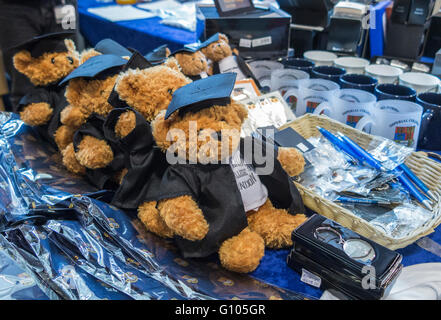 Teddy bears in academic gowns with mortar boards, souvenirs on sale at a graduation ceremony at Imperial College, South Kensington, London Stock Photo