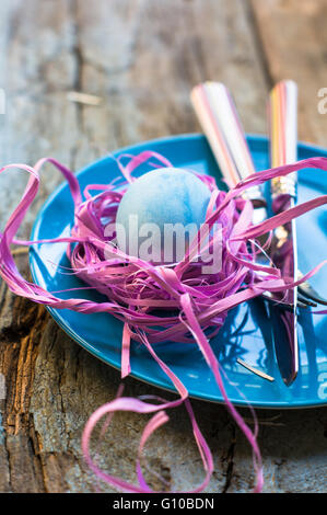Table setting for Easter festive dinner with eggs and bunny Stock Photo
