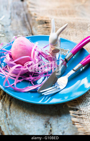 Table setting for Easter festive dinner with eggs and bunny Stock Photo