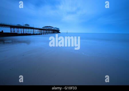 Long Exposure of the beach at Cromer Pier just before sunset Stock Photo