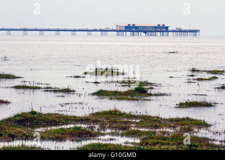 High Tide May 2016. Southport is a resort beach and has a very shallow gradient with large areas of sand exposed throughout the tidal cycle. Only at very high water is the beach completely covered up to the sea wall. There is a promenade above the beach and a pier to the north of the bathing water. Stock Photo