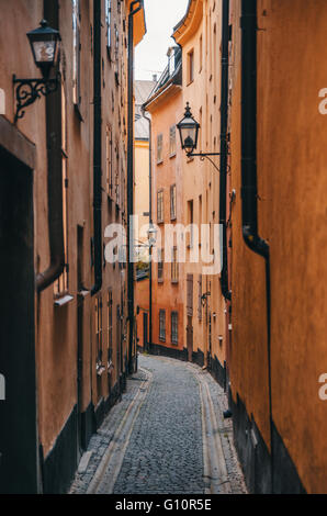 Colorful narrow street in Old Town (Gamla Stan) of Stockholm, Sweden Stock Photo